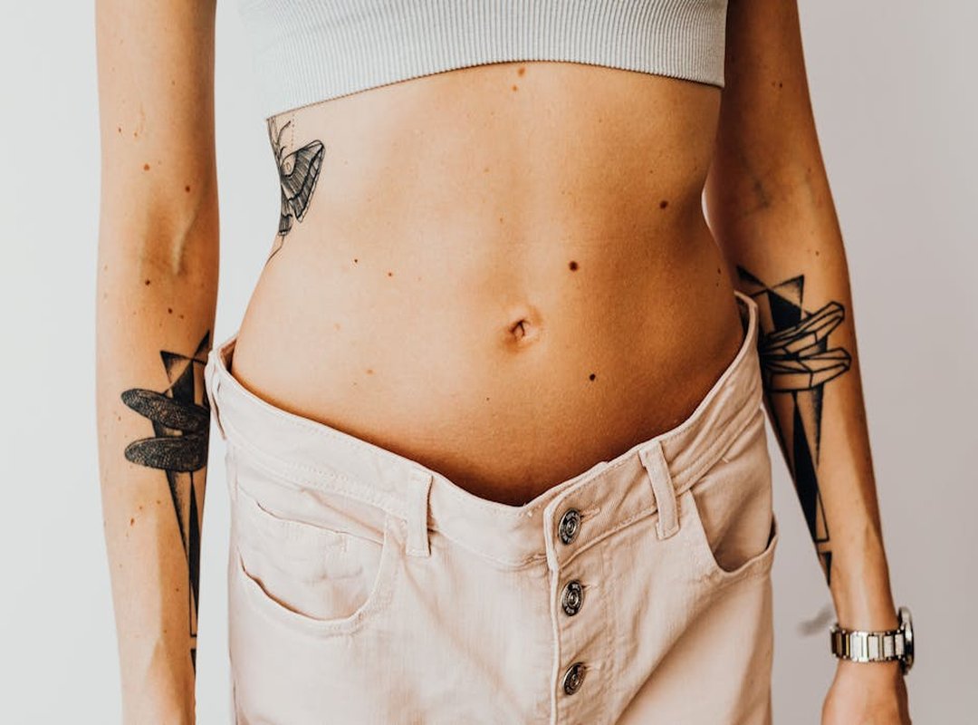 Answering Your Top Questions About Stomach Tattoos